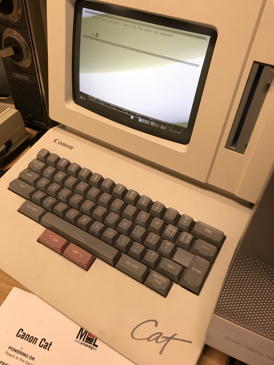 A Canon Cat computer. The text on the screen says “hello there everybody I am using the Canon Cat computer”