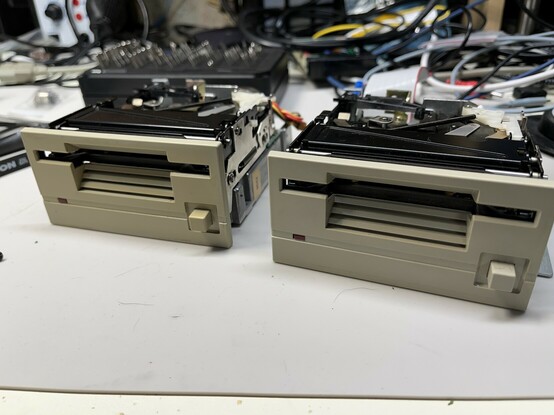 Two 3.5” floppy drives, side by side. They’re about twice as tall as a typical later floppy drive. Their face plates are beige 
